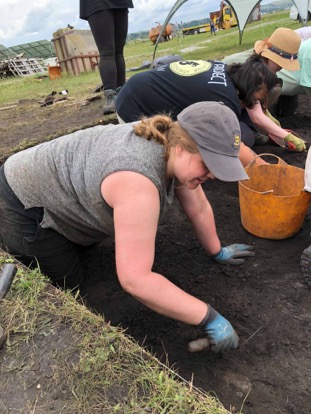 Elizabeth McGuire digging at site